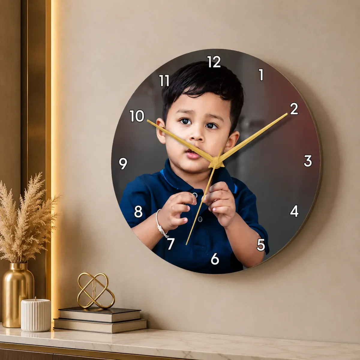 Acrylic photo wall clock with gold hands and numerals over a child’s portrait — Siri Print World, Palakollu