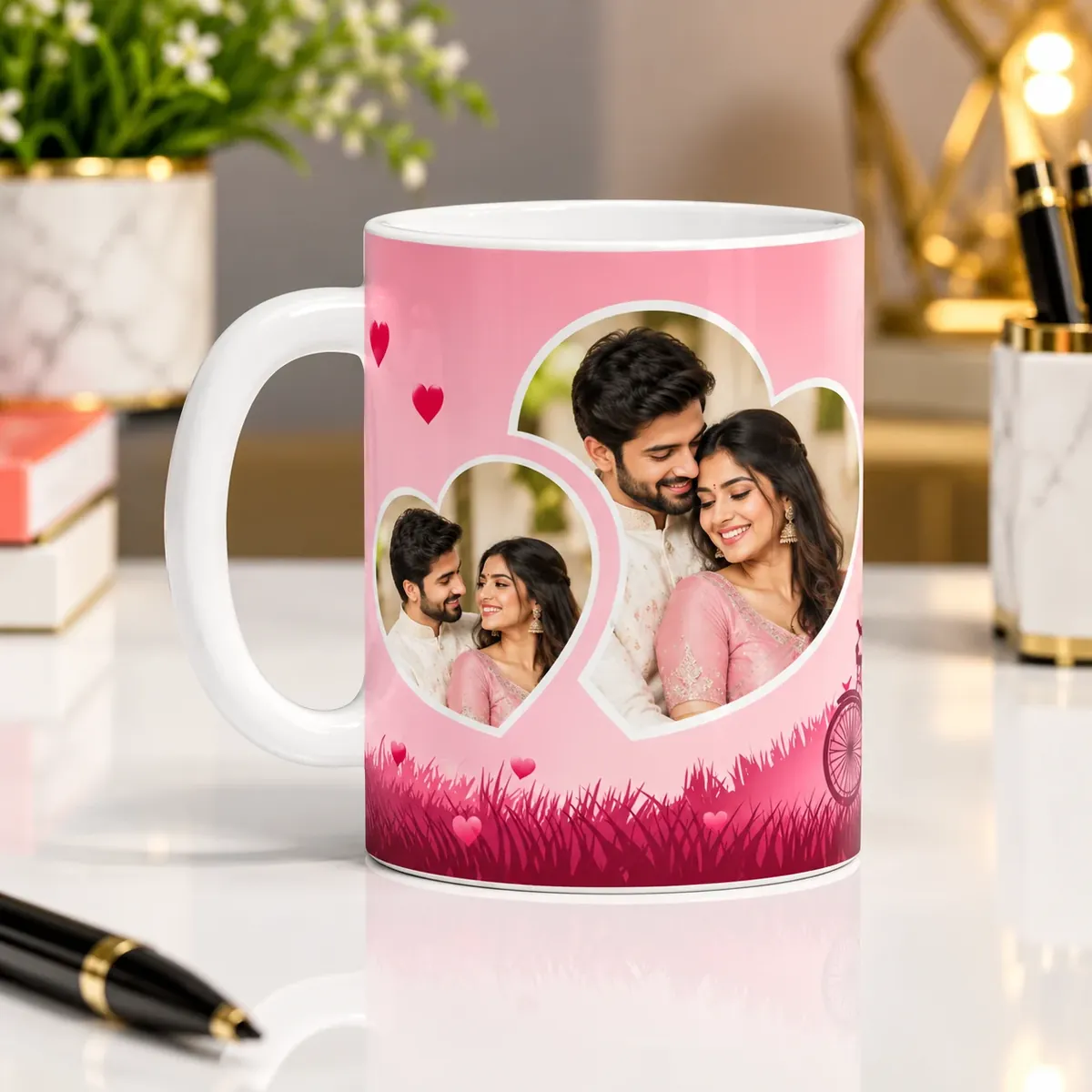 White ceramic photo mug printed with a couple’s photographs in two heart cut-outs on a pink design — Siri Print World, Palakollu