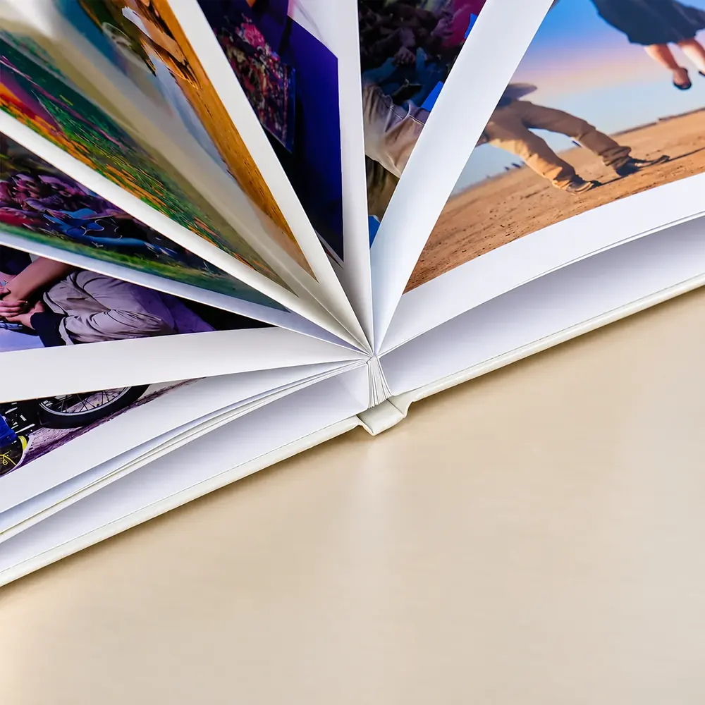 Photobook pages fanned open
