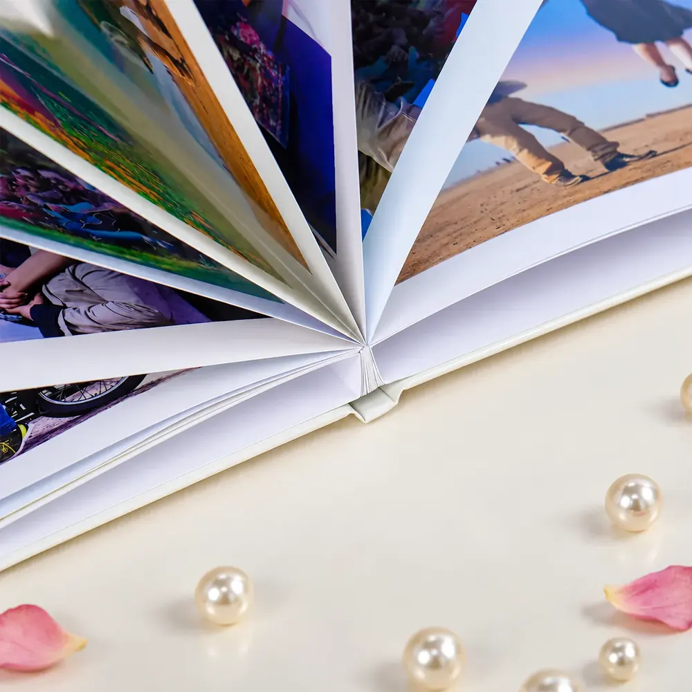 Wedding photobook pages fanned open