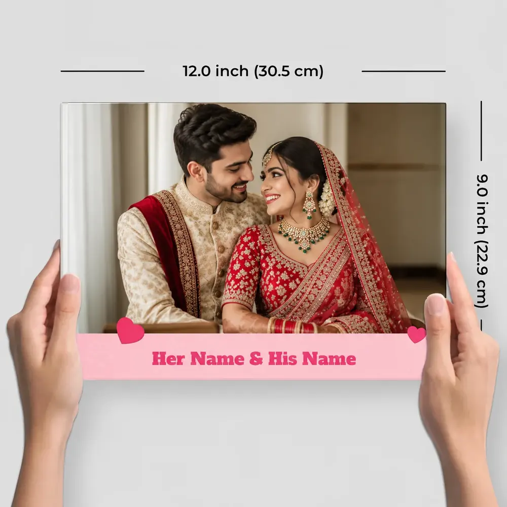 Wedding photobook held open with the couple’s names on the cover