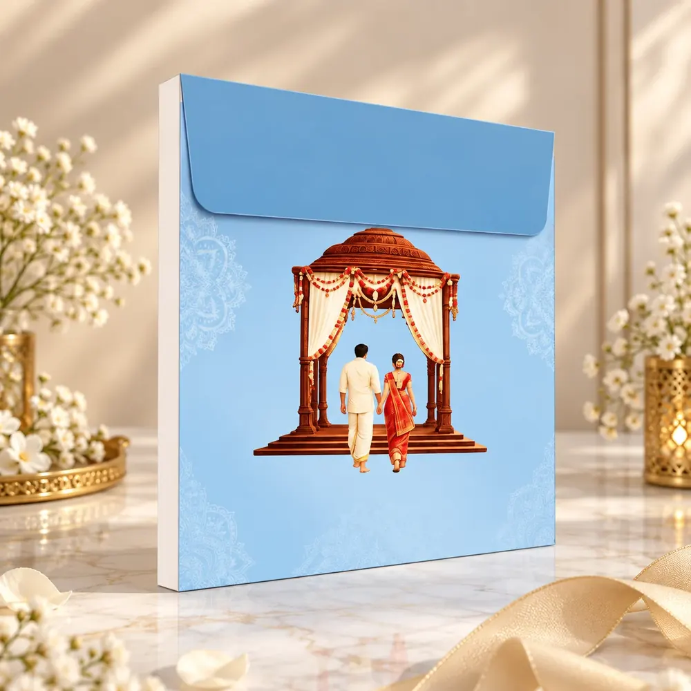Sky-blue wedding card envelope with a mandapam and couple illustration